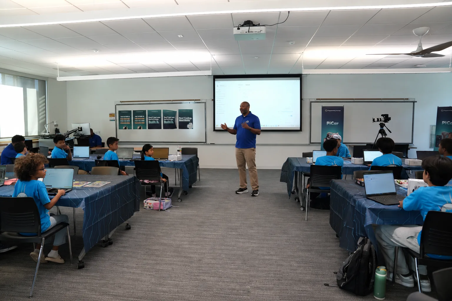 Students coding on laptops